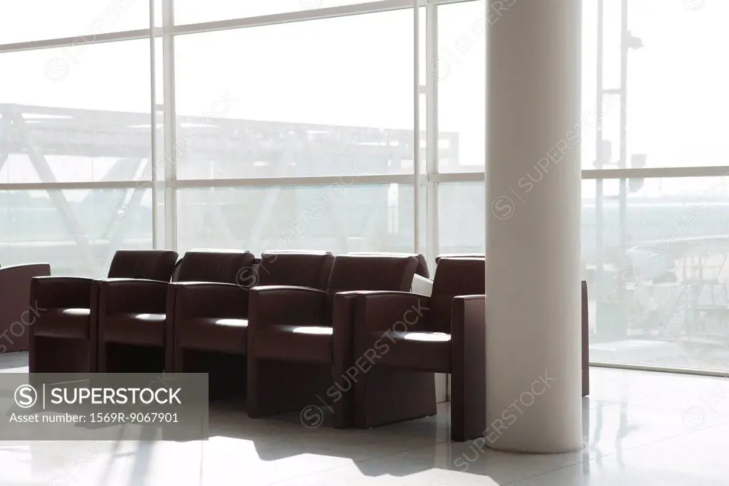 Empty armchairs in airport terminal