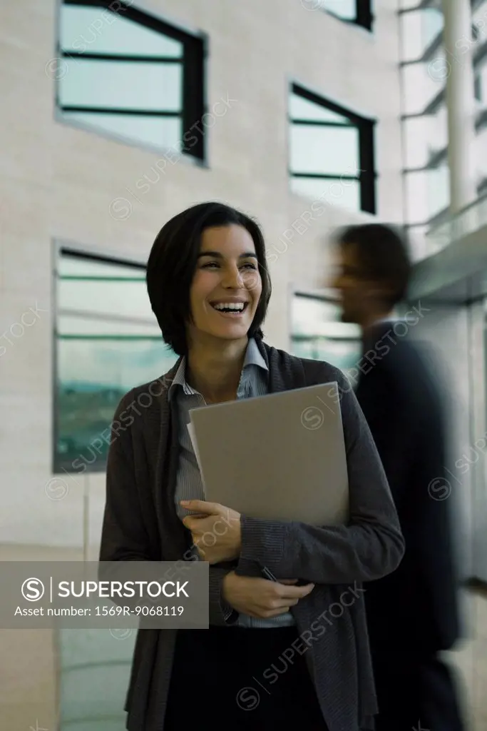 Businesswoman laughing, portrait