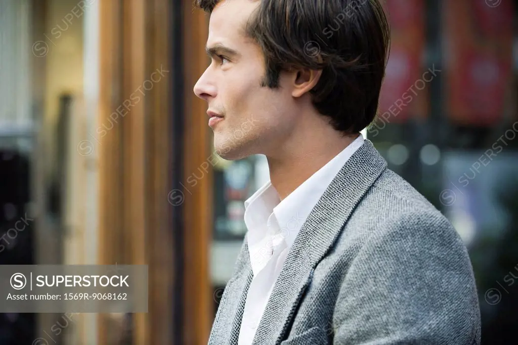 Man walking outdoors, profile