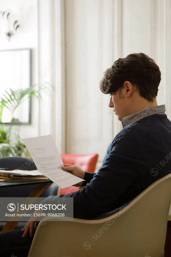 Man reading over employment contract