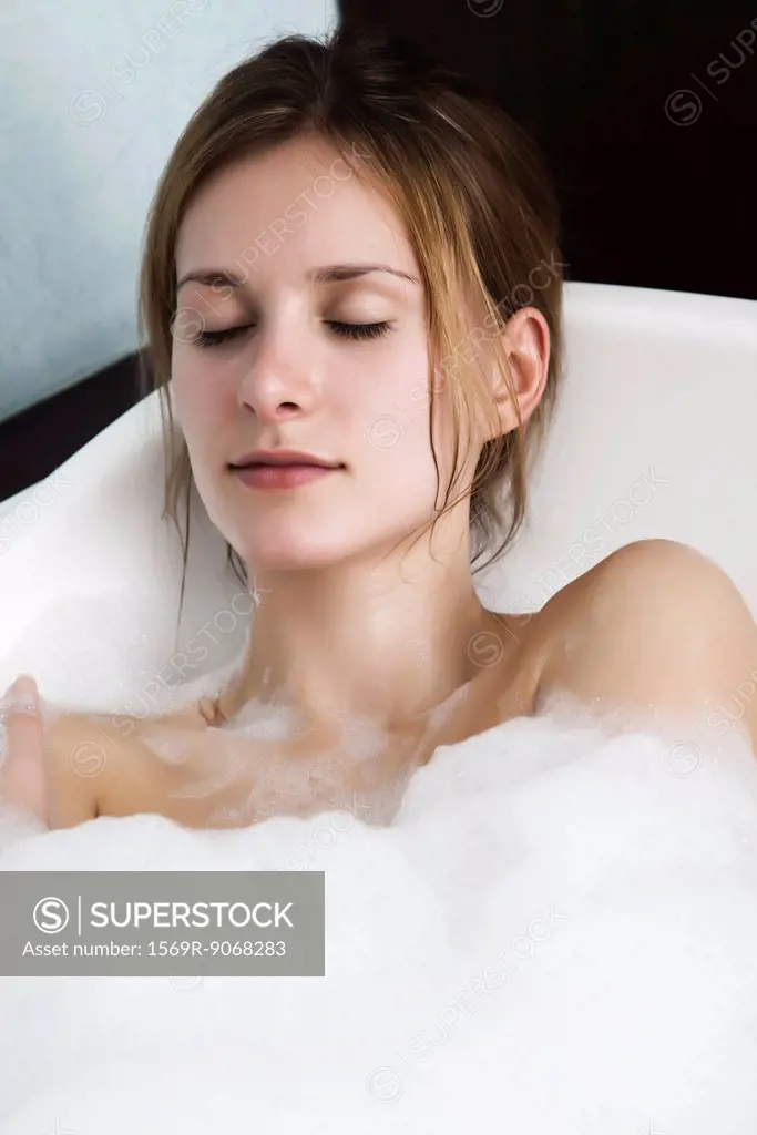 Woman relaxing in bubble bath