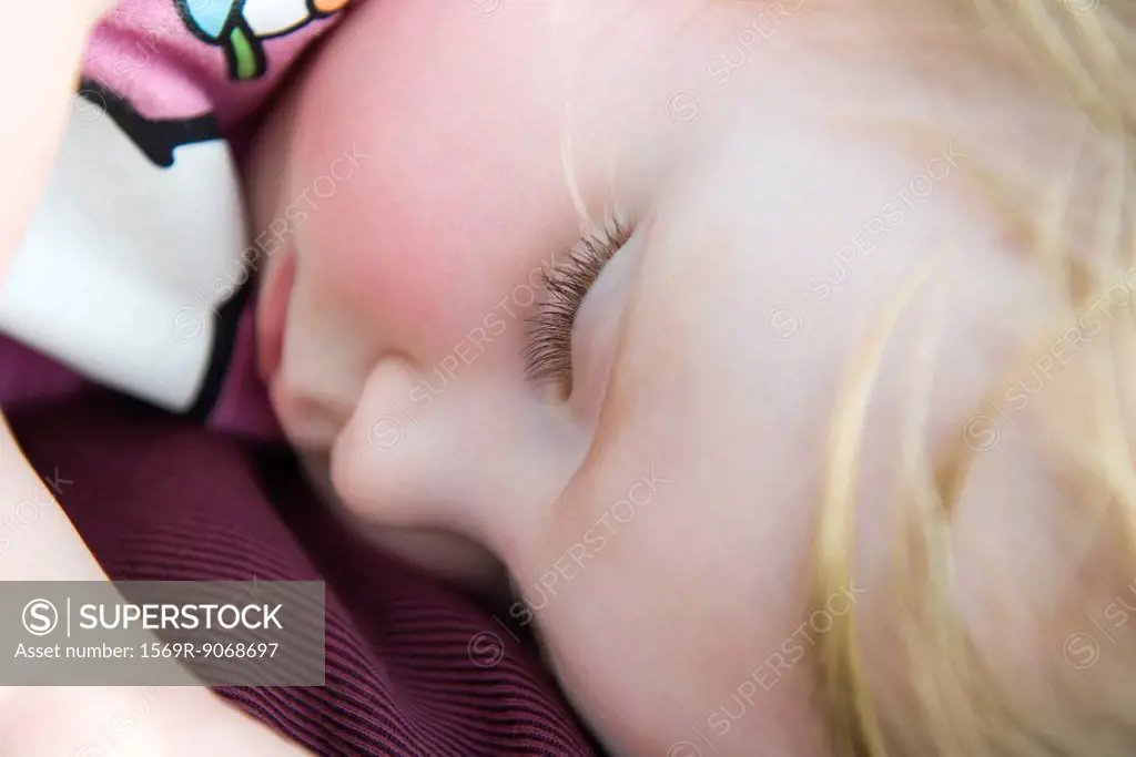 Baby girl napping, close_up