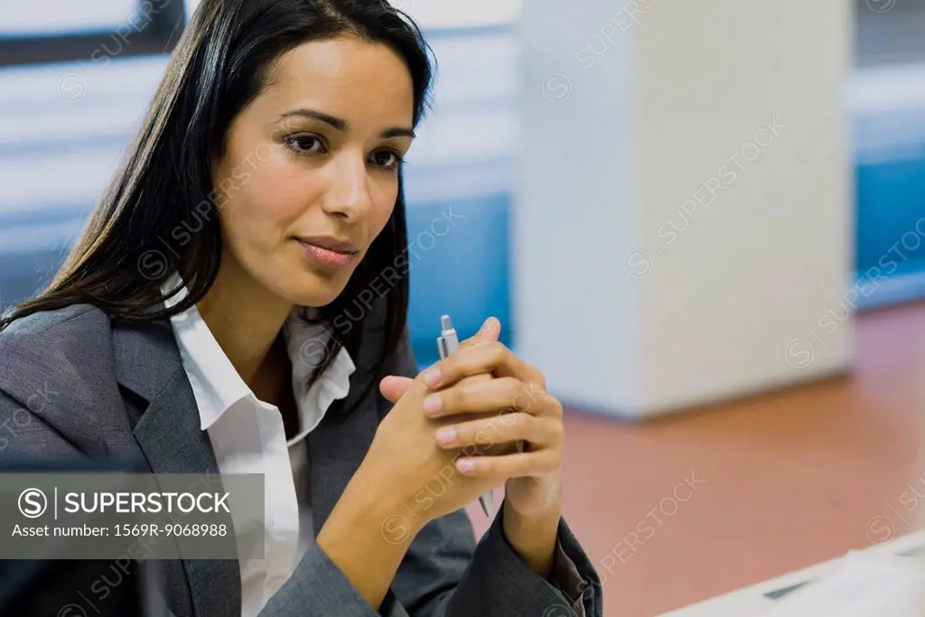 Businesswoman looking away in thought, portrait