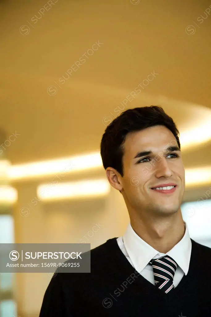 Businessman looking away in thought, portrait