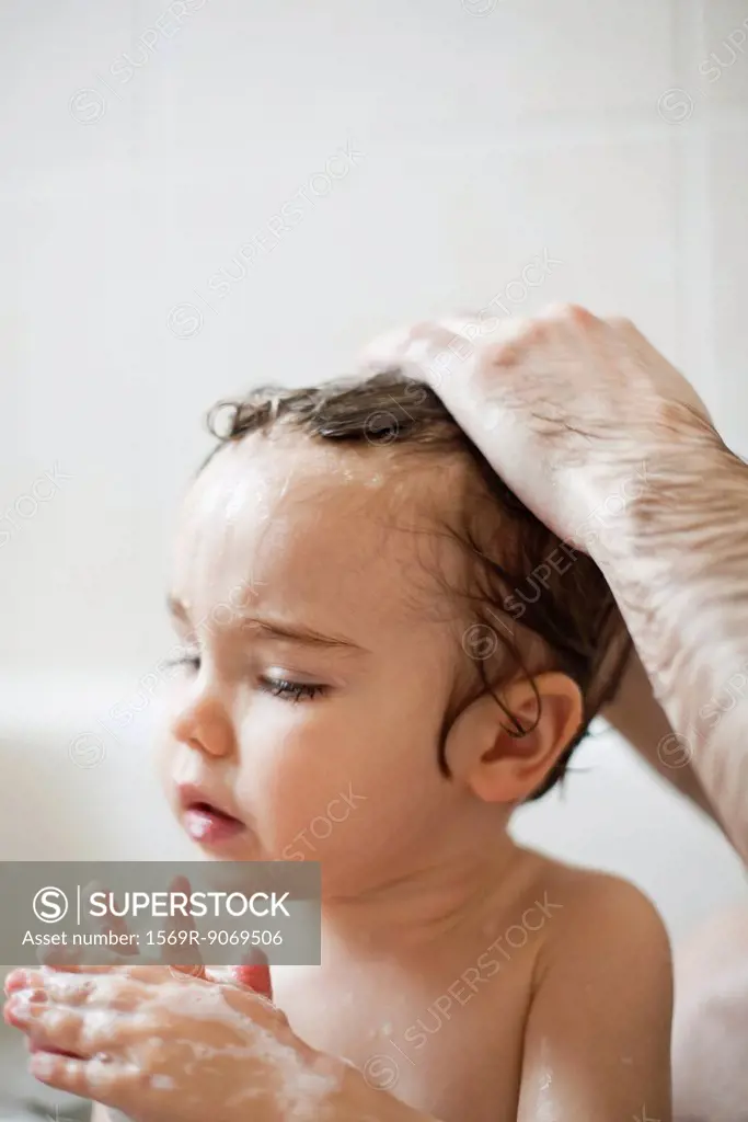Toddler boy taking a bath