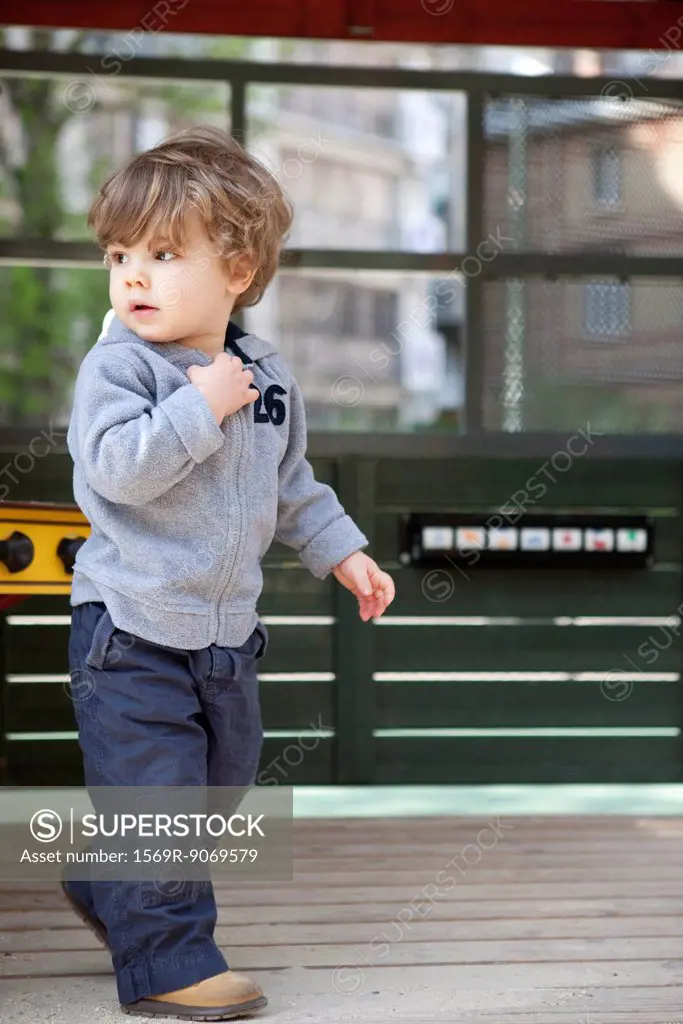 Little boy walking on playground