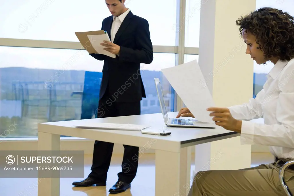 Executive working on laptop computer