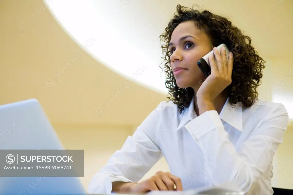 Businesswoman using cell phone