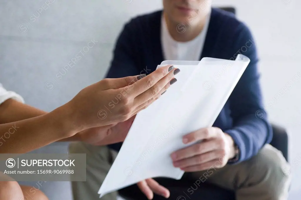 Woman´s hand holding document