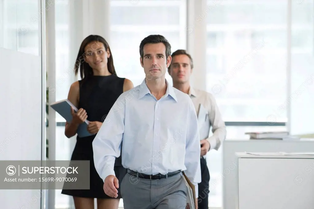 Executives walking in office