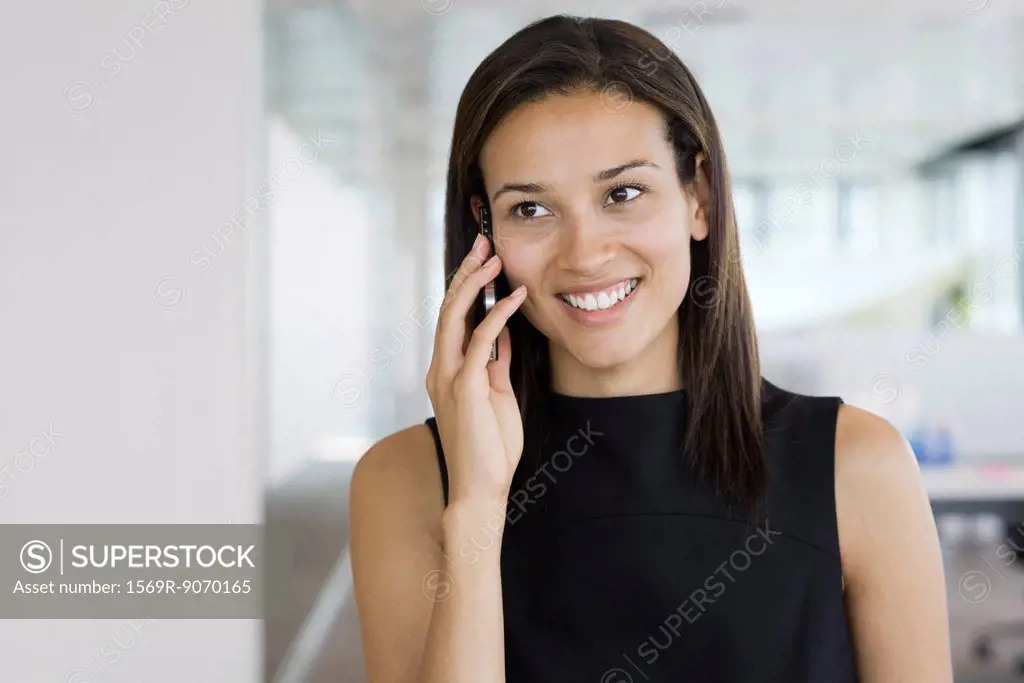 Smiling woman talking on cell phone, portrait