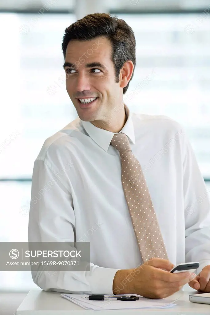 Businessman using cell phone