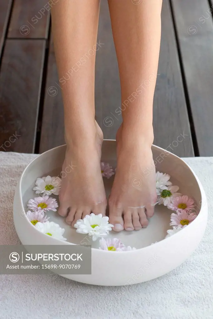 Woman enjoying relaxing foot bath