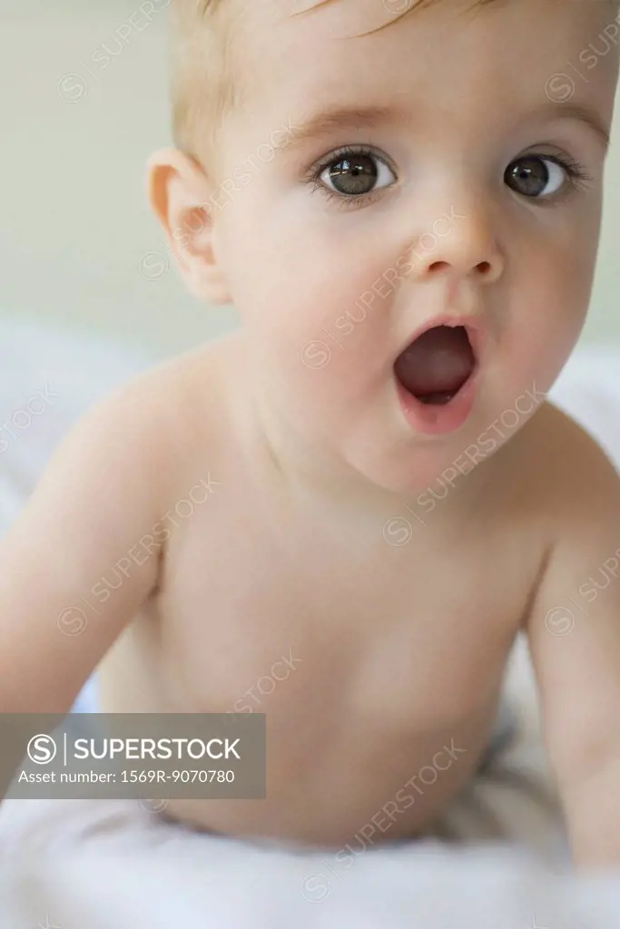 Baby with surprised expression, portrait