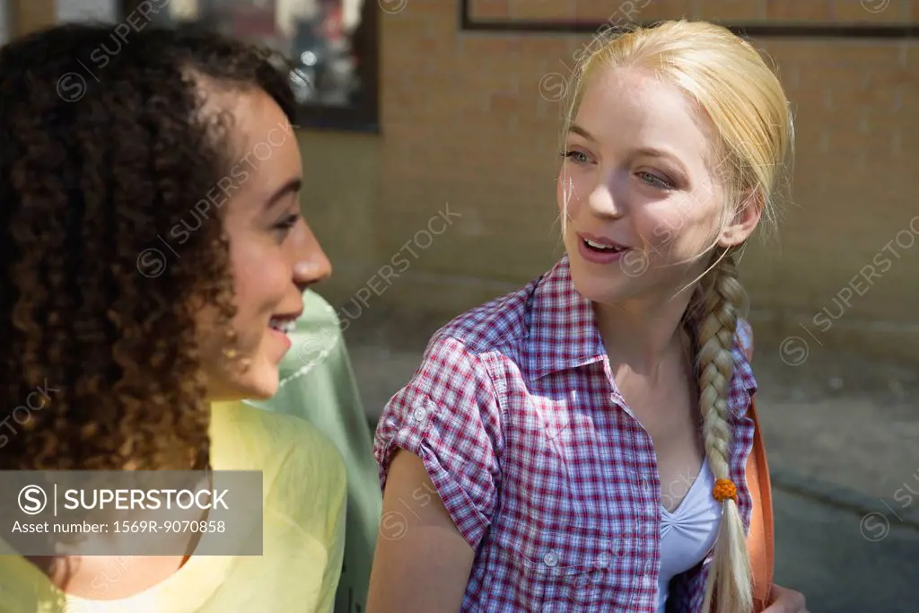 Young women chatting outdoors