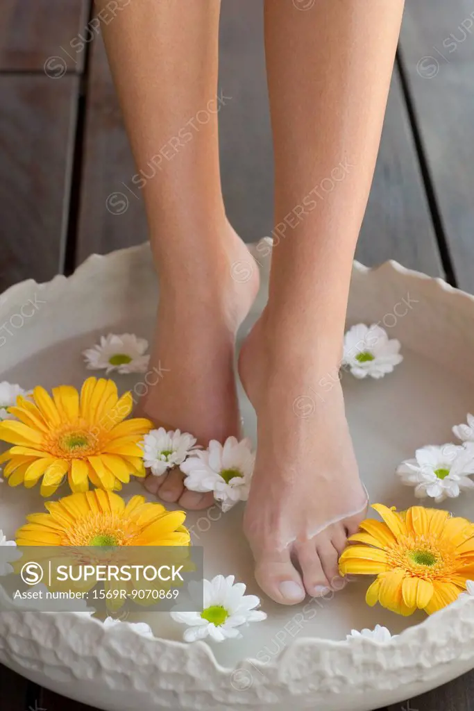 Woman enjoying relaxing foot bath