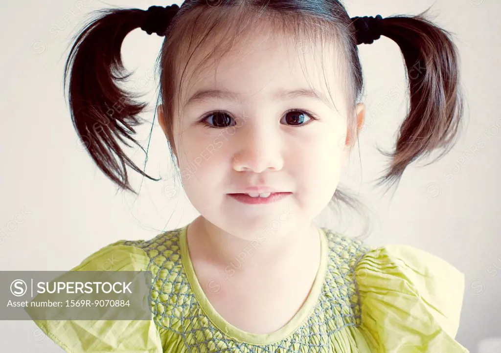 Little girl with pigtails, portrait