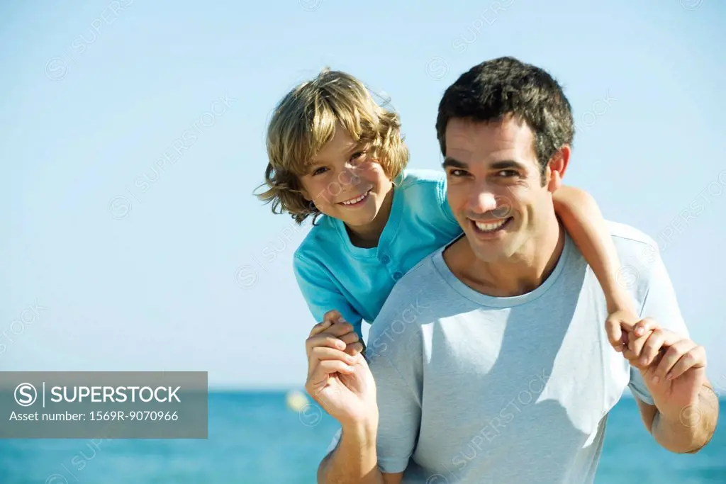 Father and son together at the beach, portrait