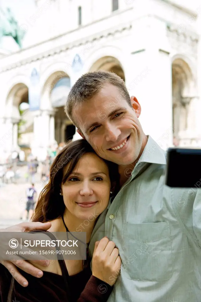 Couple posing for picture outdoors