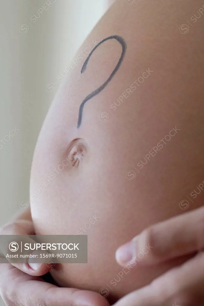 Question mark drawn on woman´s pregnant belly