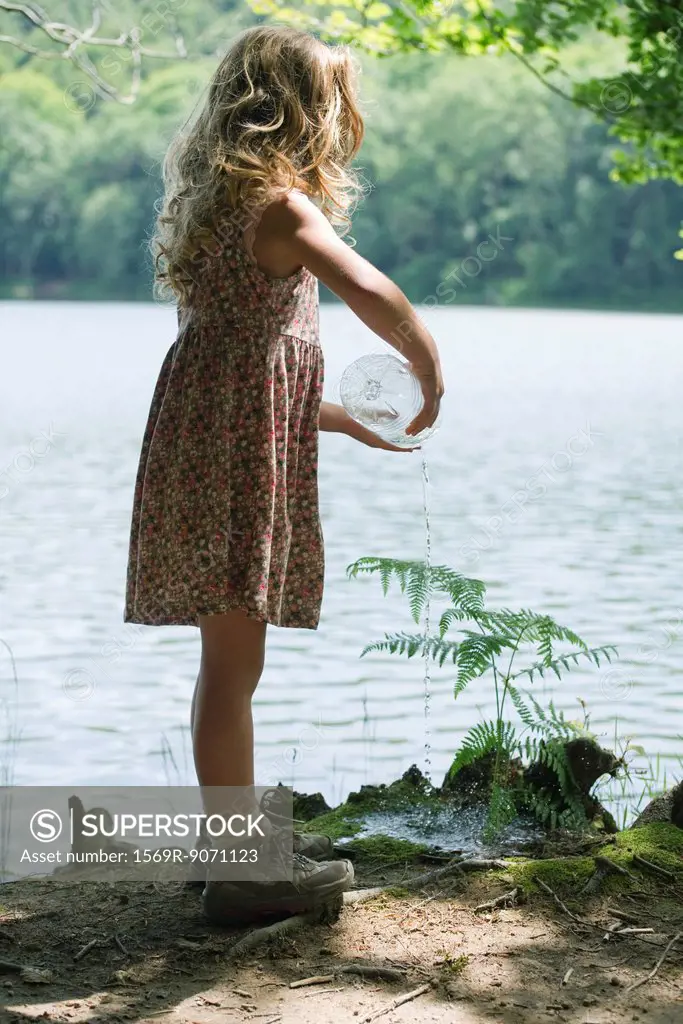Girl watering plant