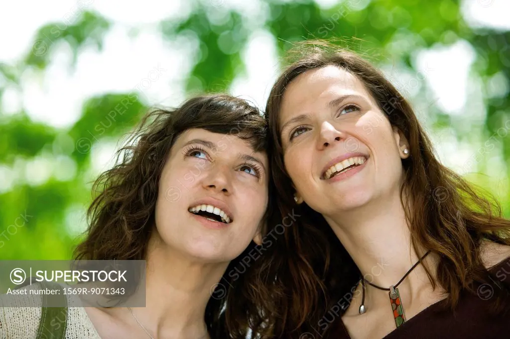 Female friends together outdoors, portrait