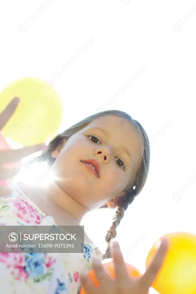 Girl with pigtails, directly below view