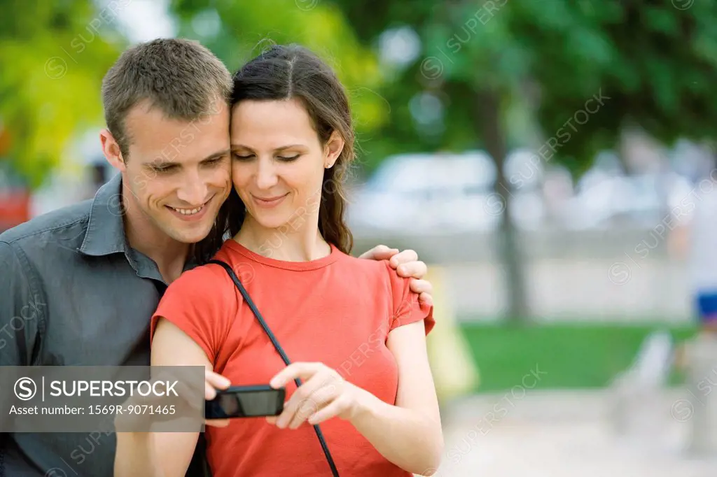 Couple posing for photo outdoors