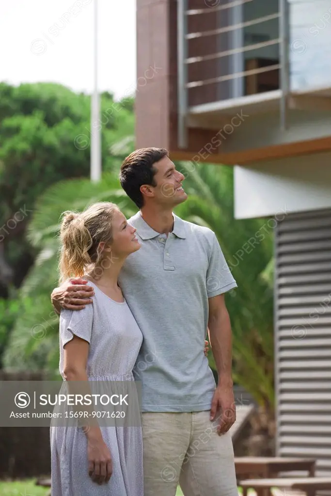Couple standing together outdoors