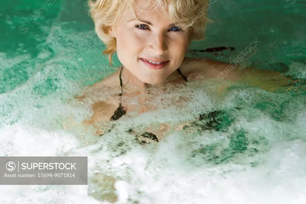 Woman relaxing in spa jacuzzi