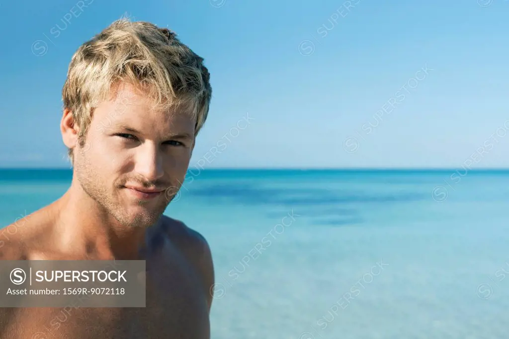 Young man on beach, portrait