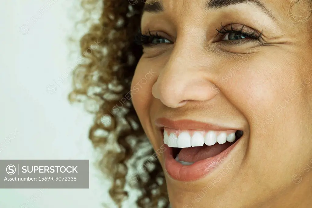 Woman smiling, close_up