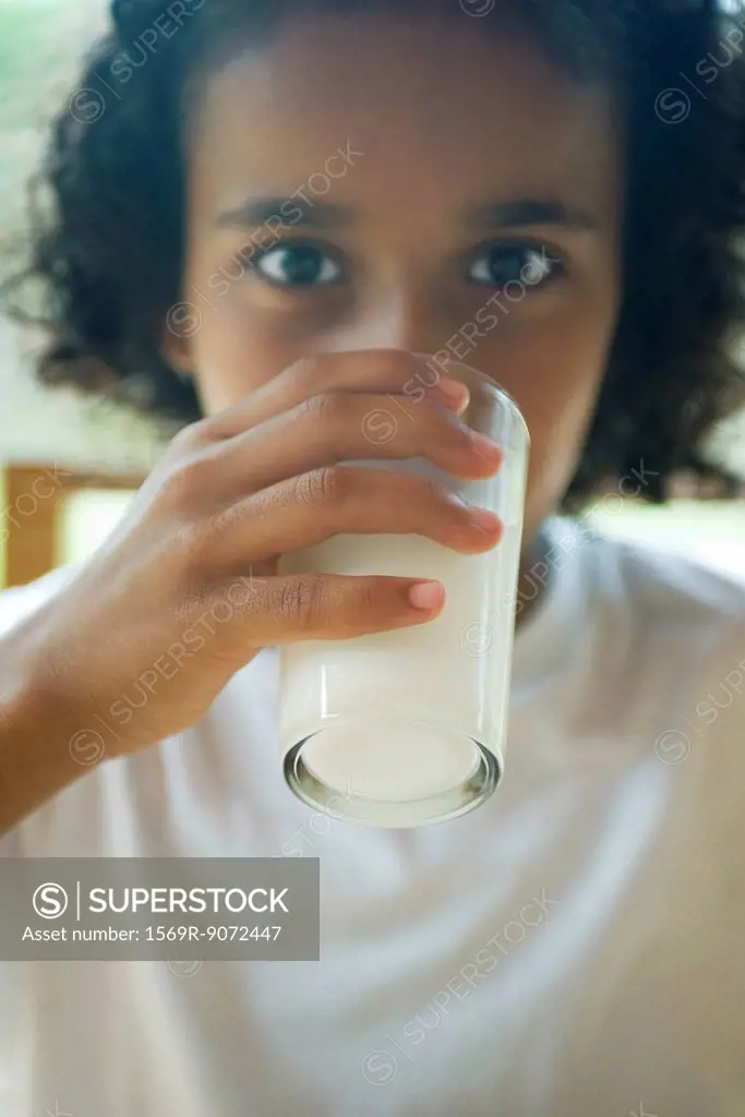 Girl drinking glass of milk