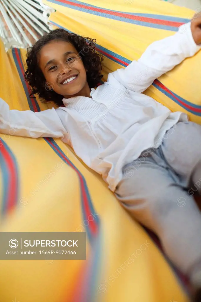 Girl lying in hammock, portrait