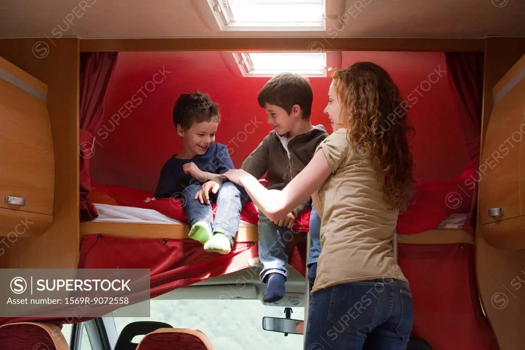 Mother and young boys in motor home