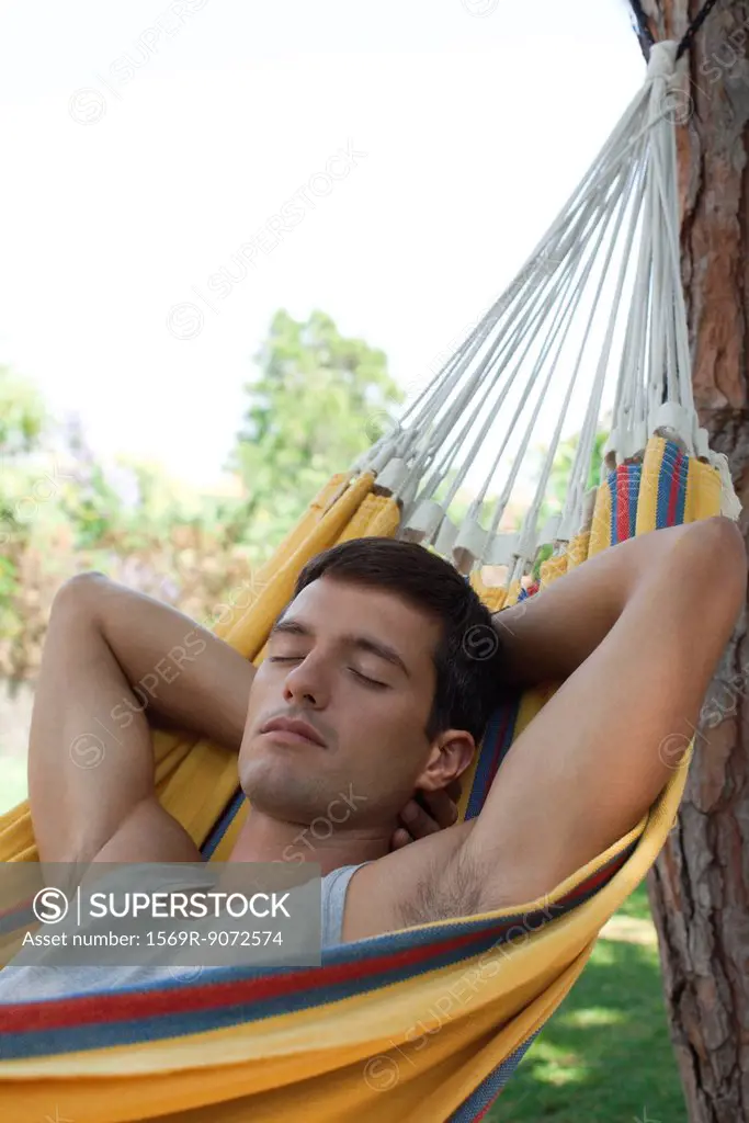 Man napping in hammock