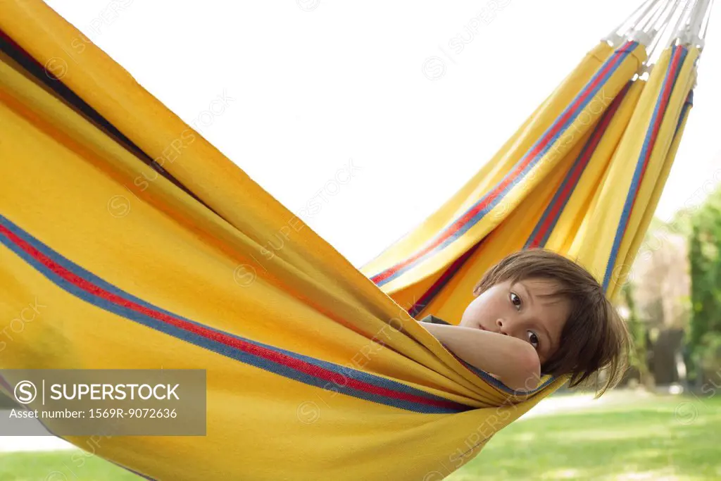 Boy lying in hammock