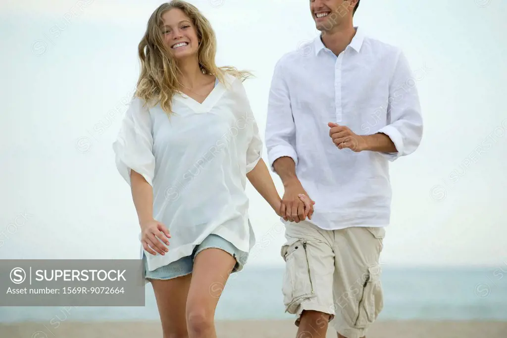 Couple walking together at the beach