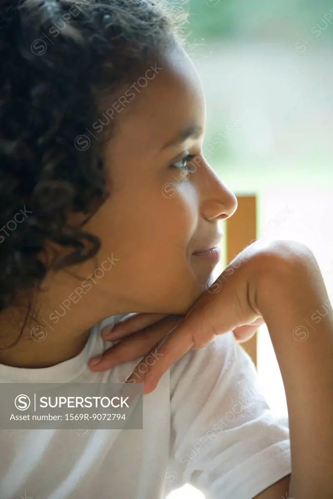 Girl looking away in thought, portrait
