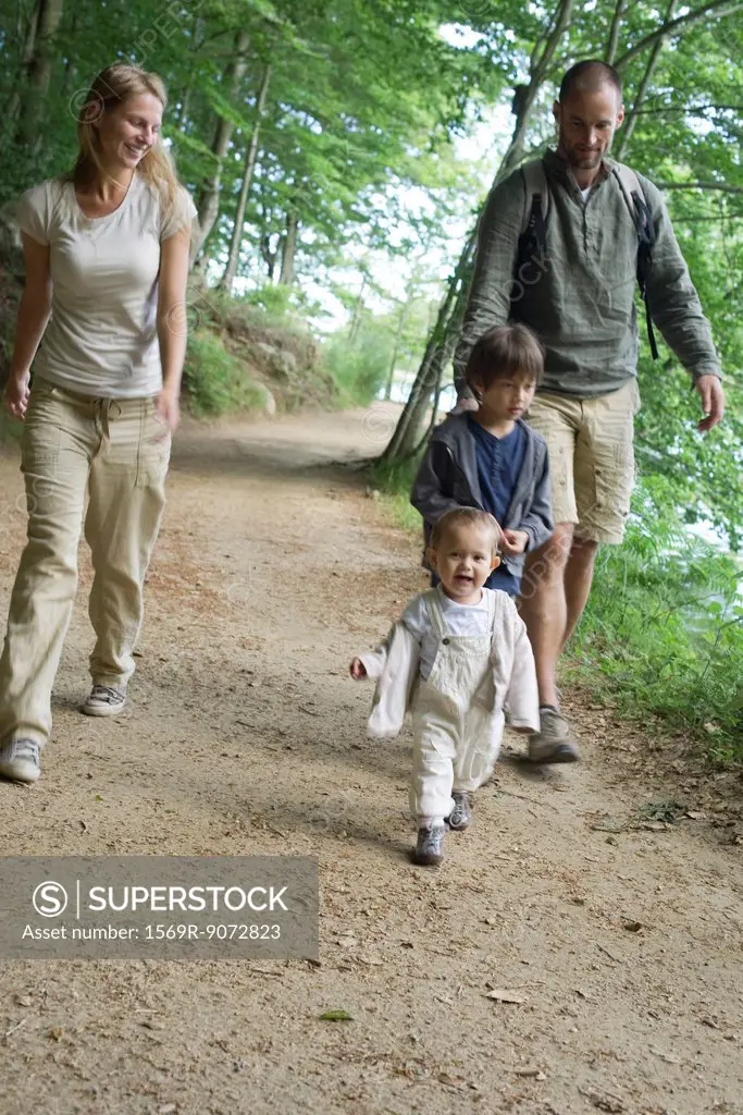Family hiking in woods