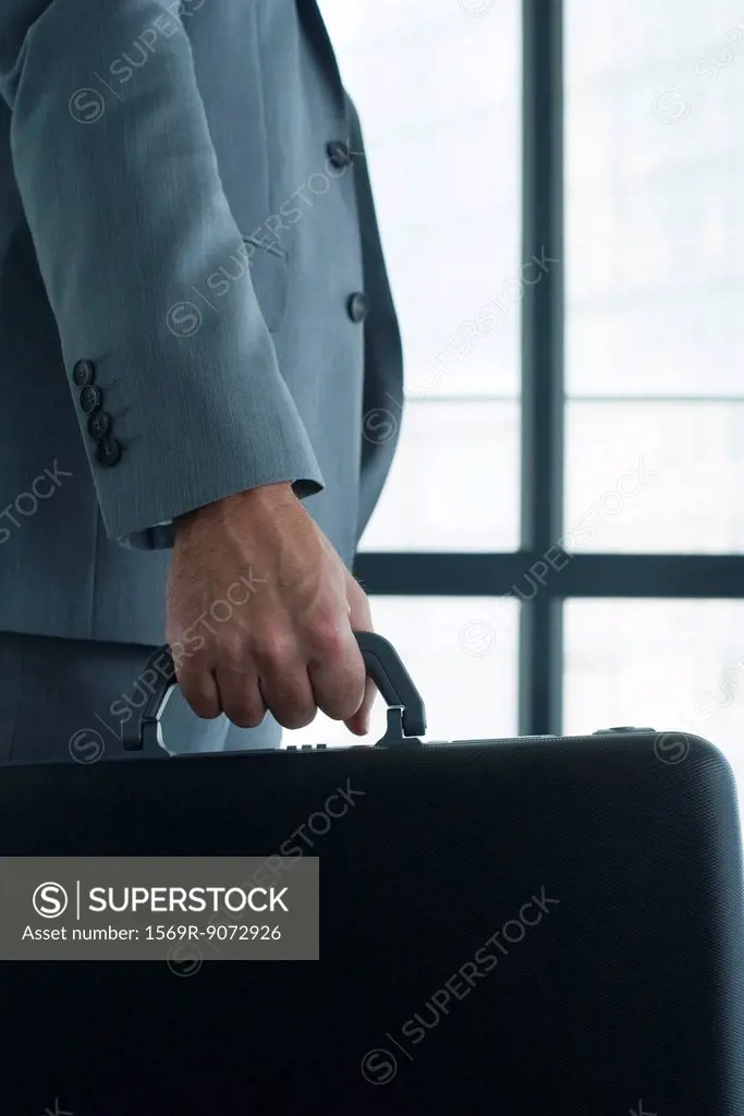 Executive carrying briefcase
