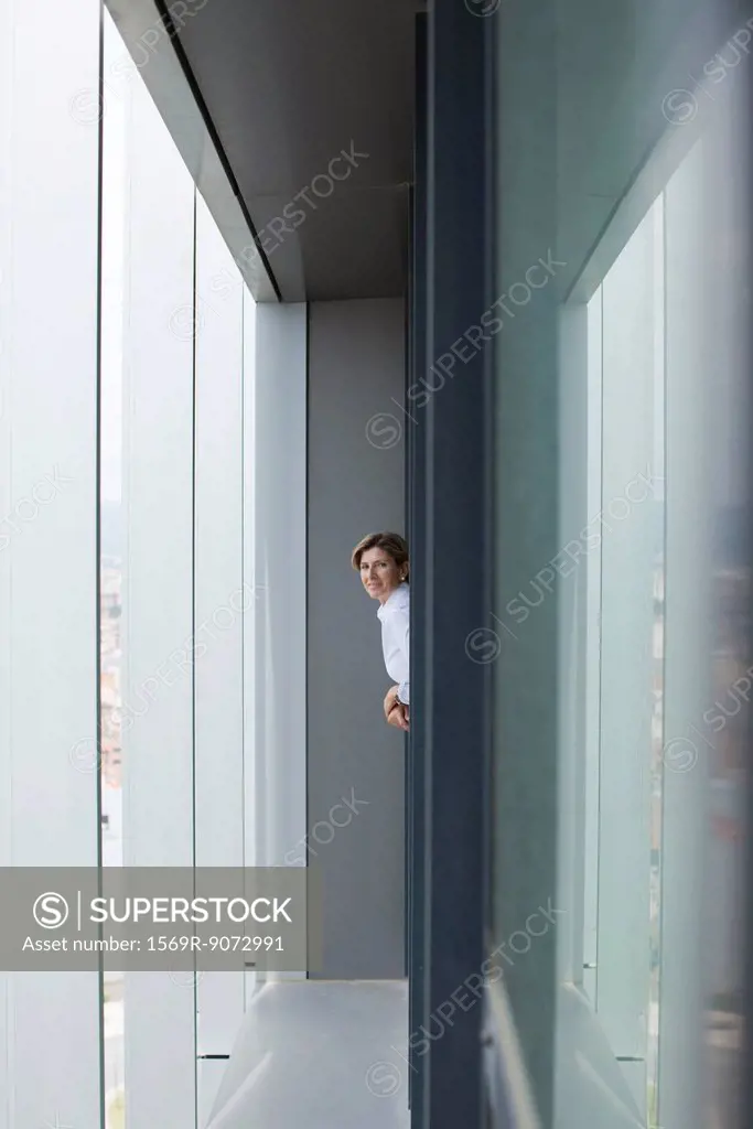 Woman leaning out of office window
