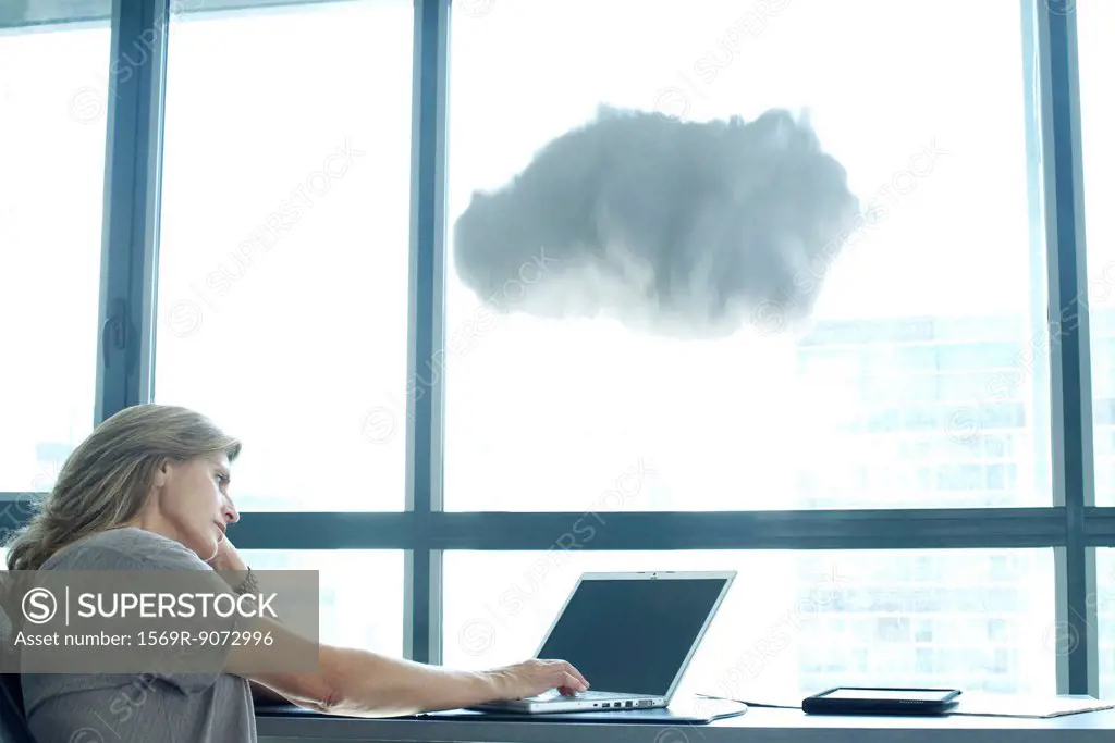 Woman using laptop computer. cloud above laptop computer