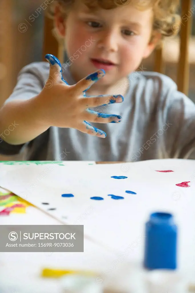 Little boy finger painting
