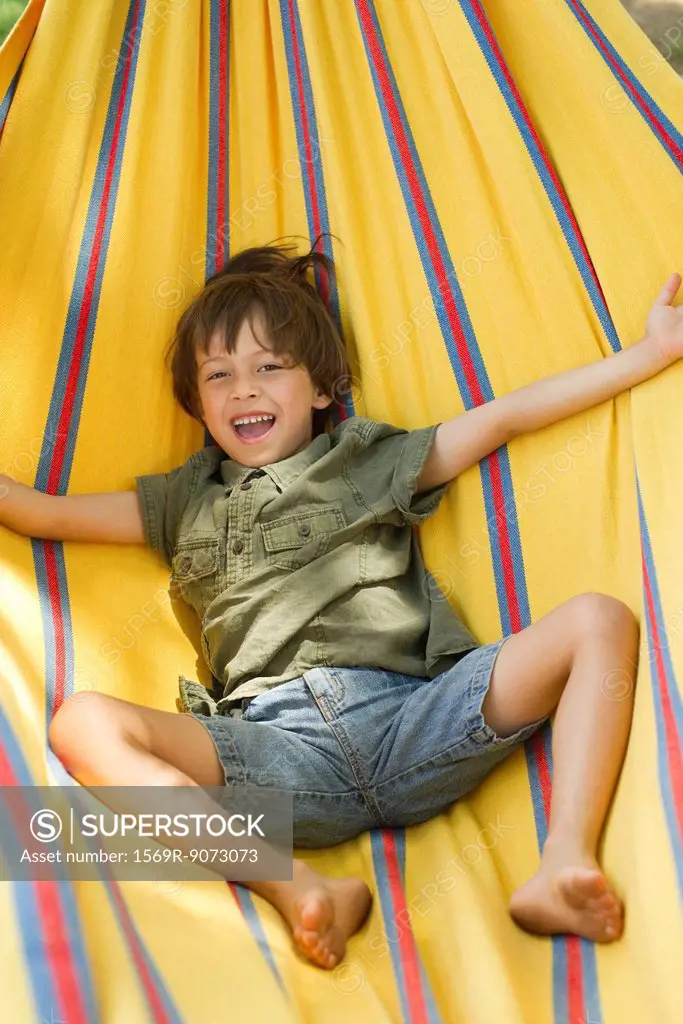 Boy lying in hammock, portrait