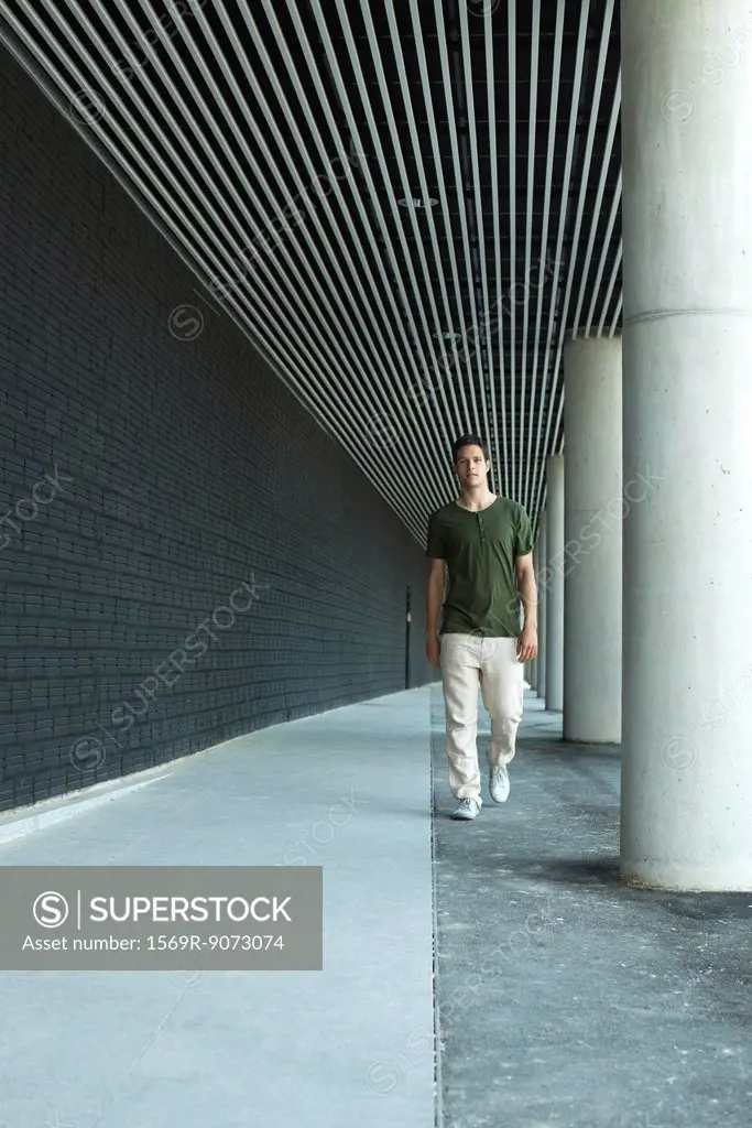 Man walking on colonnade