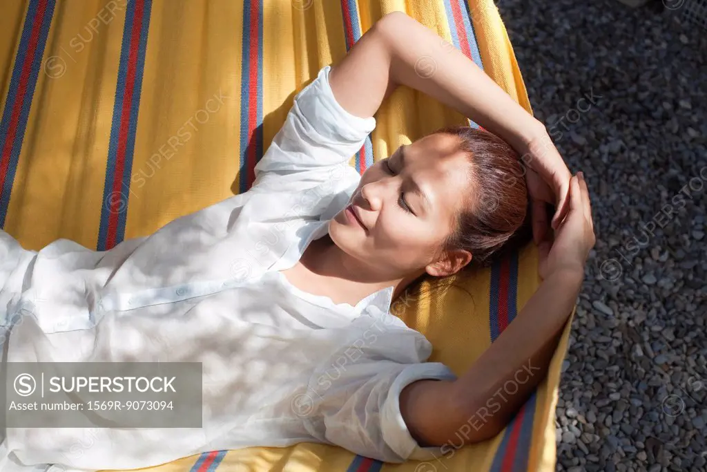 Woman napping in hammock