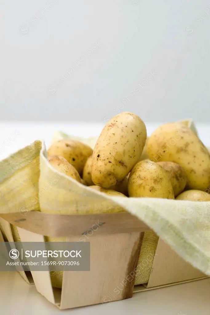 Fresh potatoes in basket