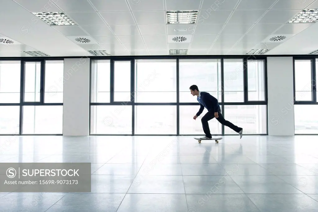 Man skateboarding indoors