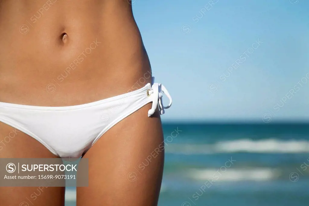Woman in bikini bottom, mid section